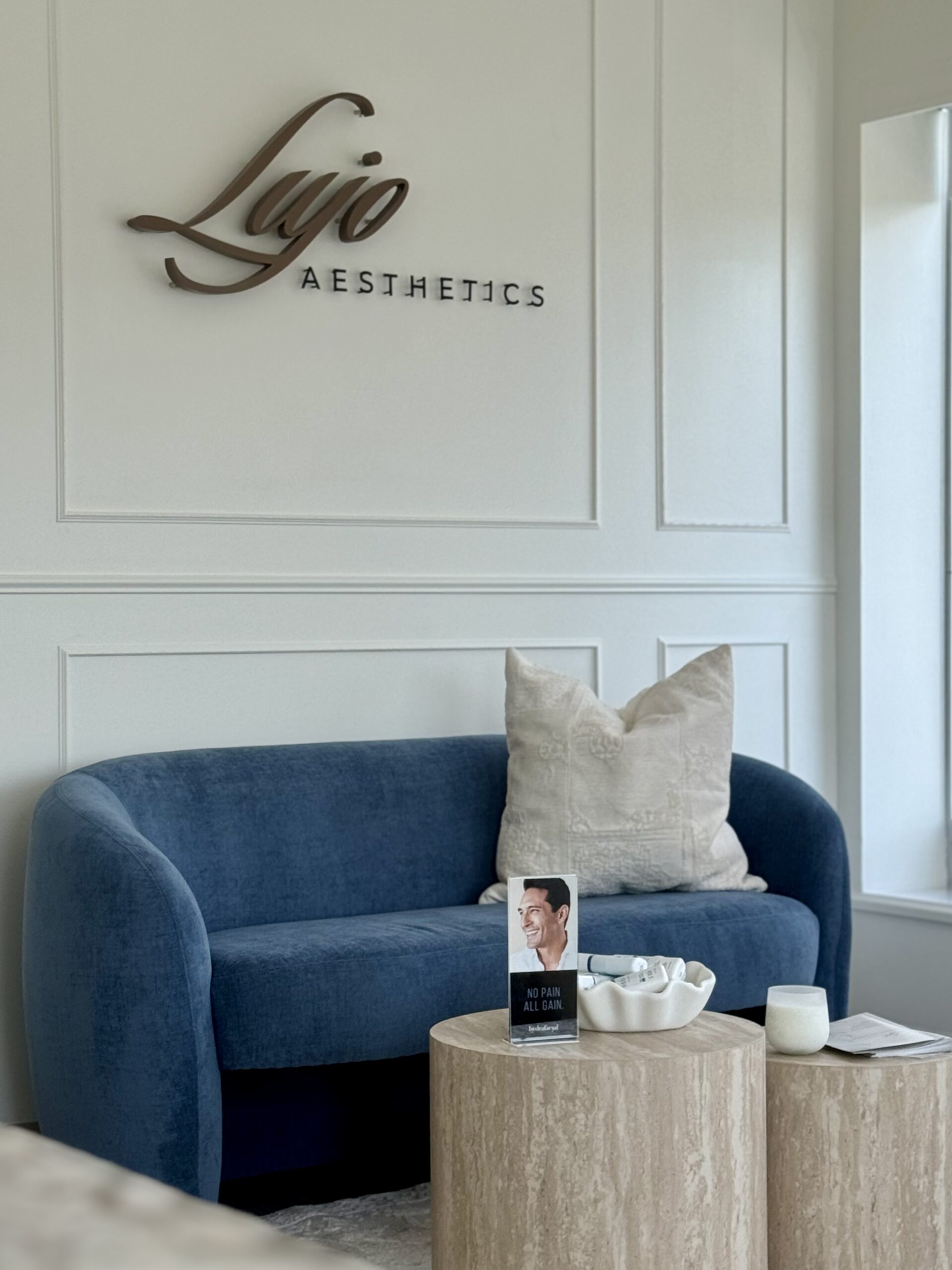Clean, professional medical spa treatment room with neutral tones at Lujo Aesthetics in Plymouth